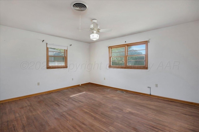 709 Franklin Ave, Panhandle, TX 79068 - unfurnished room with plenty of natural light, ceiling fan, and baseboards