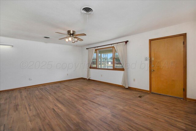 709 Franklin Ave, Panhandle, TX 79068 - empty room with wood finished floors, baseboards, and ceiling fan