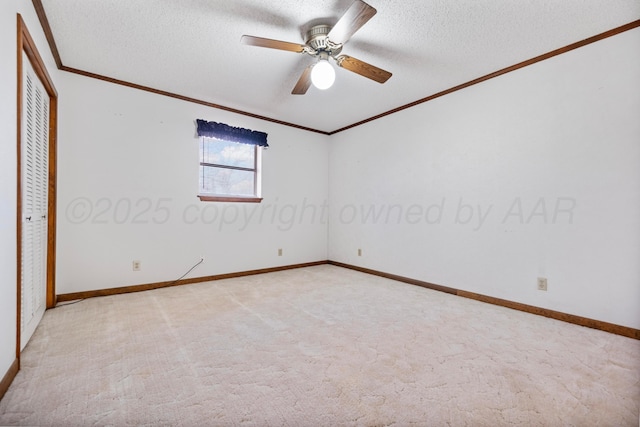 unfurnished bedroom featuring light colored carpet, a closet, ornamental molding, and a textured ceiling