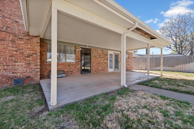 view of patio / terrace featuring fence