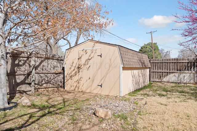 view of shed with a fenced backyard