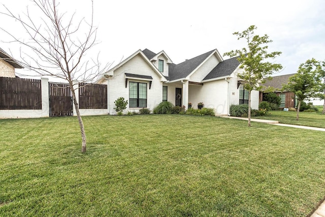 5904 Nancy Ellen St, Amarillo, TX 79119 - view of front of house featuring a gate, a shingled roof, and brick siding