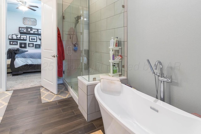 5904 Nancy Ellen St, Amarillo, TX 79119 - ensuite bathroom with wood finished floors, a stall shower, a freestanding bath, and a ceiling fan