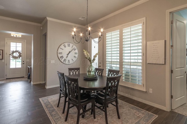 5904 Nancy Ellen St, Amarillo, TX 79119 - dining space featuring a chandelier, dark wood-style flooring, and crown molding
