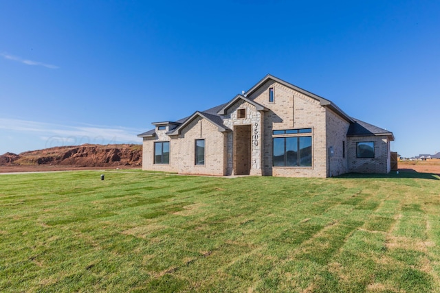 view of front of home with a front lawn