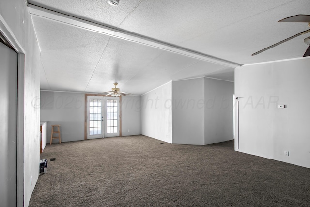 unfurnished living room with ceiling fan, french doors, and carpet floors