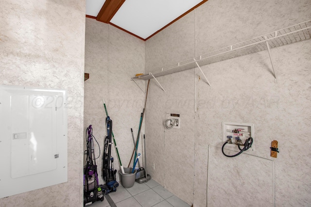 washroom featuring electric panel, hookup for a washing machine, and light tile patterned floors