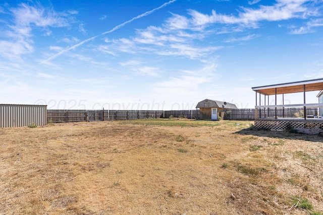 view of yard with a wooden deck