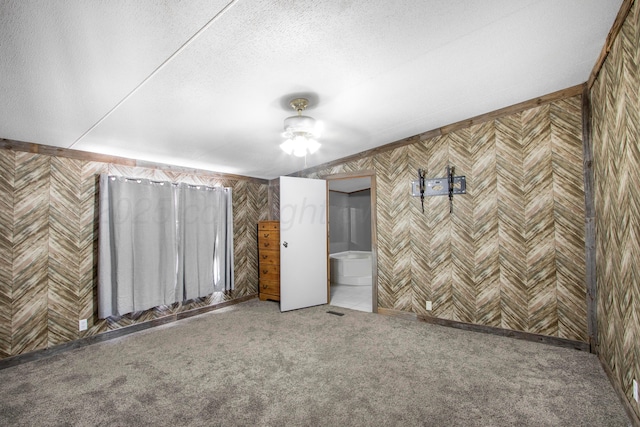 unfurnished room with a textured ceiling