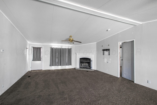 unfurnished living room featuring vaulted ceiling with beams, ceiling fan, carpet, and ornamental molding