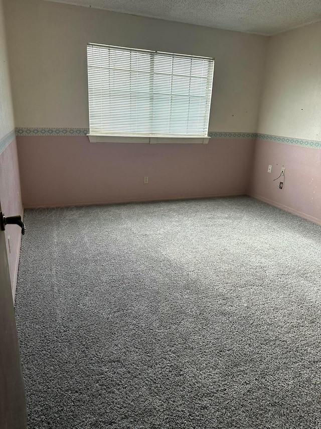 spare room featuring a textured ceiling