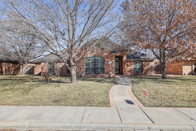 ranch-style house with a front yard