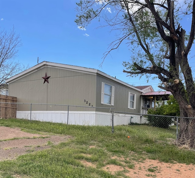 view of property exterior featuring fence