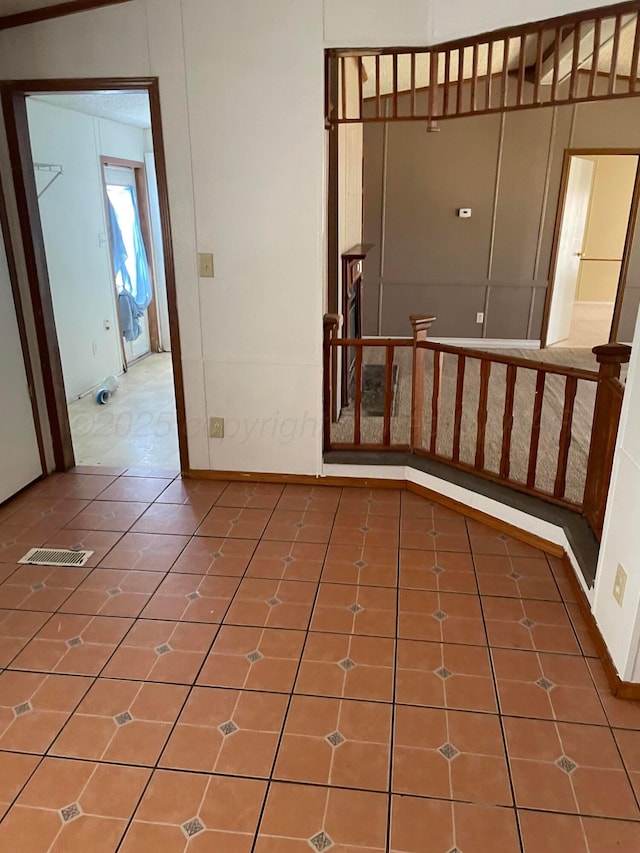 tiled spare room with baseboards