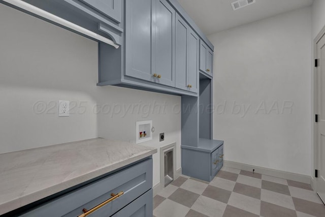 5505 Sheridan St, Amarillo, TX 79119 - laundry room with electric dryer hookup, light floors, cabinet space, and washer hookup