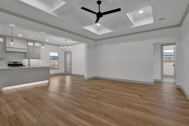 5505 Sheridan St, Amarillo, TX 79119 - unfurnished living room featuring a raised ceiling, light wood-style flooring, recessed lighting, a ceiling fan, and a fireplace