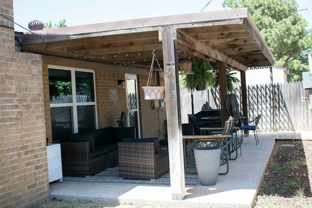 view of patio / terrace with outdoor lounge area and fence