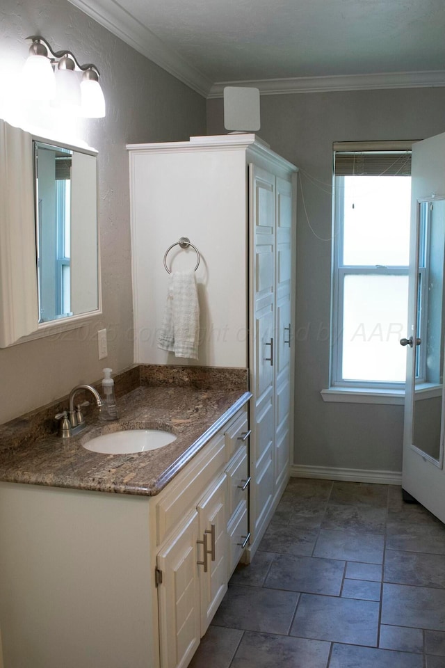 bathroom featuring vanity and ornamental molding