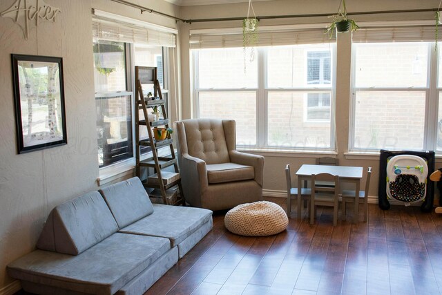 interior space with hardwood / wood-style floors and baseboards