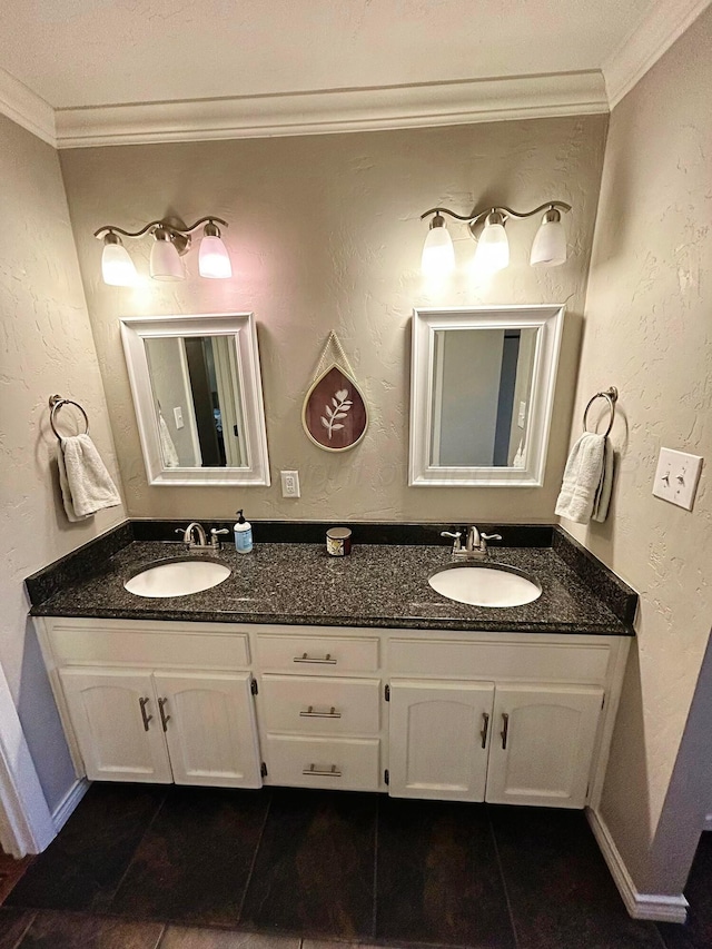 bathroom with crown molding, double vanity, and a sink