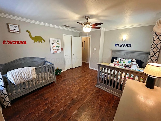 bedroom with crown molding, a ceiling fan, visible vents, wood-type flooring, and baseboards