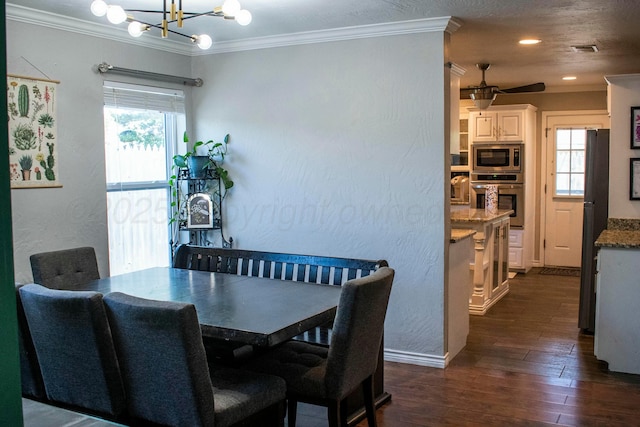 dining area with dark wood-style floors, crown molding, and a healthy amount of sunlight