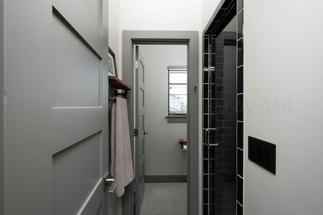 1600 S Milam St, Amarillo, TX 79102 - full bathroom with a shower stall, baseboards, and tile patterned flooring