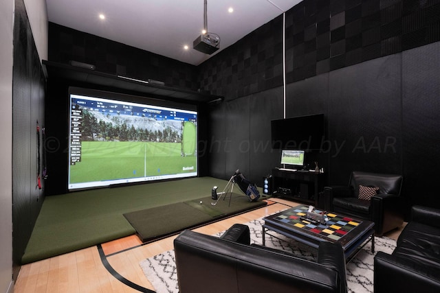 1600 S Milam St, Amarillo, TX 79102 - cinema room with golf simulator, wood finished floors, and a towering ceiling