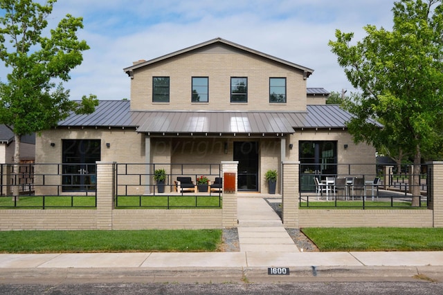 1600 S Milam St, Amarillo, TX 79102 - view of front of home with brick siding, a standing seam roof, metal roof, and a porch