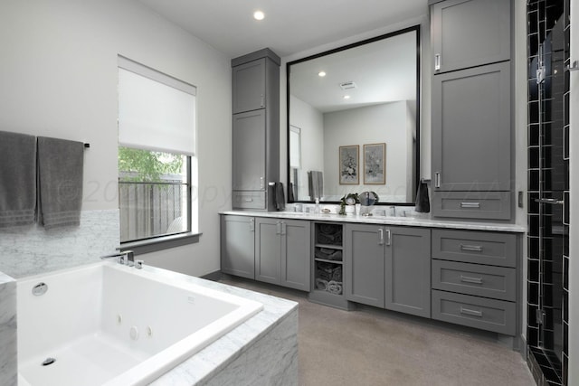 1600 S Milam St, Amarillo, TX 79102 - full bathroom featuring double vanity, a tub with jets, and recessed lighting