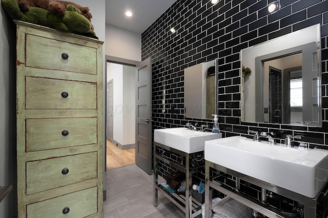 1600 S Milam St, Amarillo, TX 79102 - bathroom with tile walls, a sink, recessed lighting, backsplash, and tile patterned floors