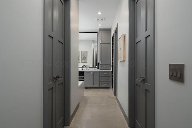 1600 S Milam St, Amarillo, TX 79102 - hallway featuring baseboards, finished concrete flooring, and recessed lighting