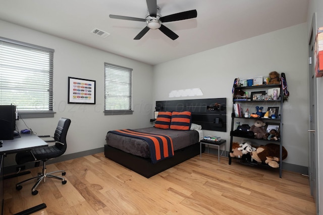1600 S Milam St, Amarillo, TX 79102 - bedroom with light wood-style flooring, multiple windows, a desk, and a ceiling fan