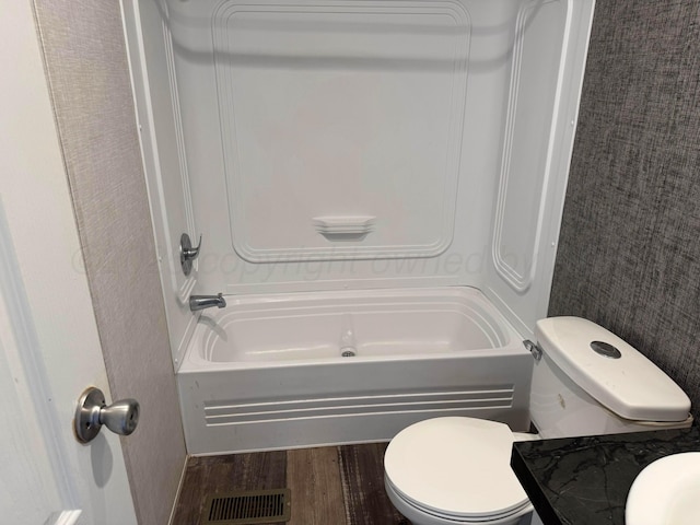 6 Honeywood Pl, Dalhart, TX 79023 - full bath with visible vents, toilet, bathtub / shower combination, and wood finished floors