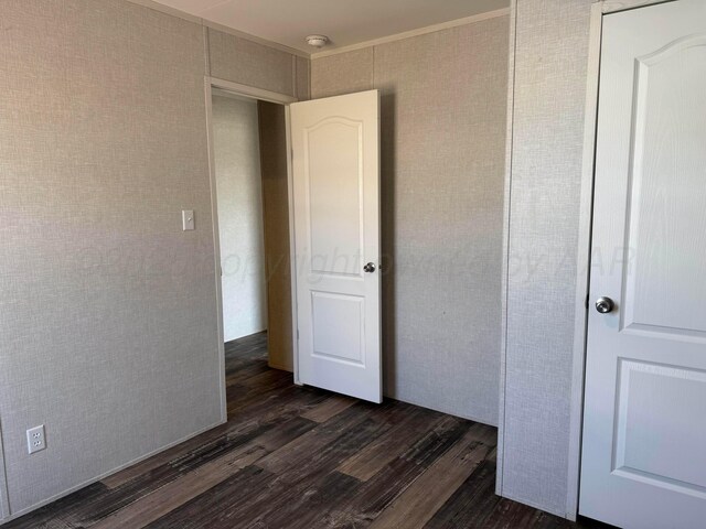 6 Honeywood Pl, Dalhart, TX 79023 - unfurnished bedroom featuring dark wood finished floors