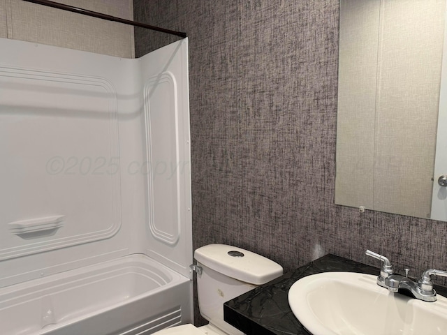 6 Honeywood Pl, Dalhart, TX 79023 - bathroom featuring vanity, bathtub / shower combination, toilet, and decorative backsplash