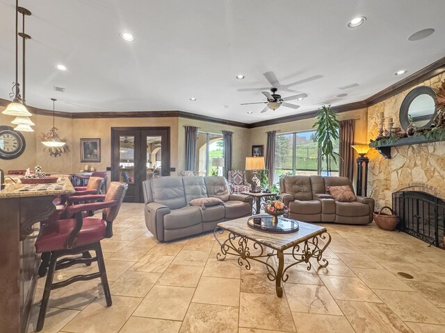 38 Merion Pl, Amarillo, TX 79124 - living room featuring ceiling fan, recessed lighting, a fireplace, and crown molding
