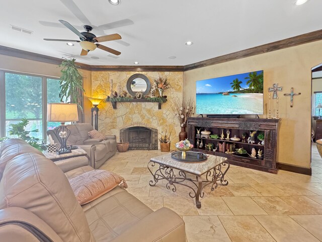 38 Merion Pl, Amarillo, TX 79124 - living area with ornamental molding, a ceiling fan, recessed lighting, stone tile flooring, and a fireplace