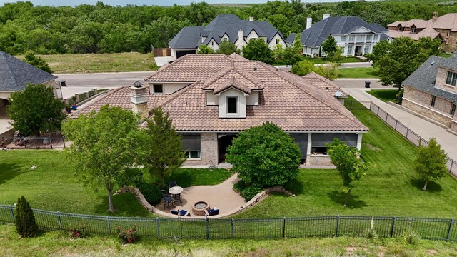 38 Merion Pl, Amarillo, TX 79124 - back of property with a tile roof, a fenced backyard, a residential view, and stucco siding