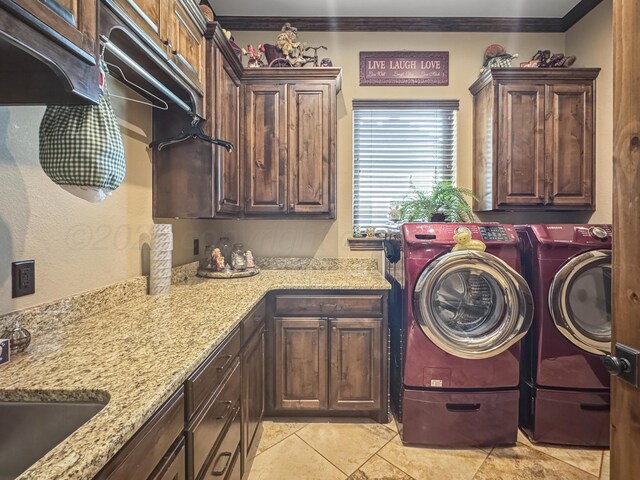 38 Merion Pl, Amarillo, TX 79124 - washroom with cabinet space, independent washer and dryer, ornamental molding, and light tile patterned floors