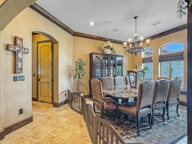 38 Merion Pl, Amarillo, TX 79124 - dining space with crown molding, arched walkways, a chandelier, and a textured wall