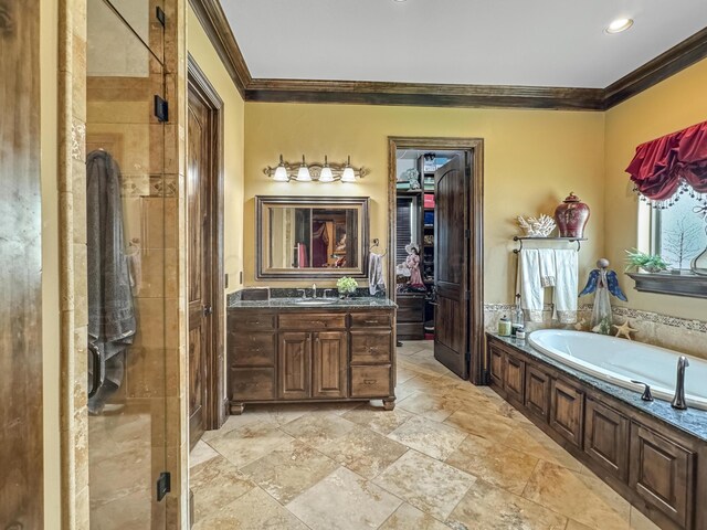 38 Merion Pl, Amarillo, TX 79124 - full bathroom with crown molding, a garden tub, vanity, a shower stall, and recessed lighting