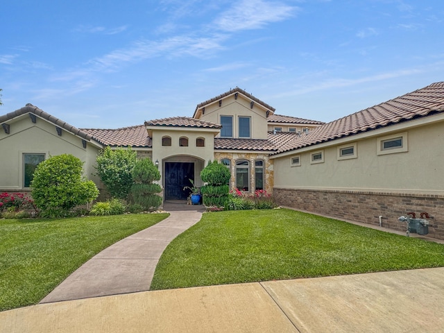 38 Merion Pl, Amarillo, TX 79124 - mediterranean / spanish-style home with a front lawn, stucco siding, and a tile roof