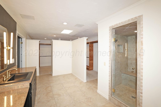 3801 Deann Dr, Amarillo, TX 79121 - bathroom featuring vanity, a shower stall, crown molding, and recessed lighting