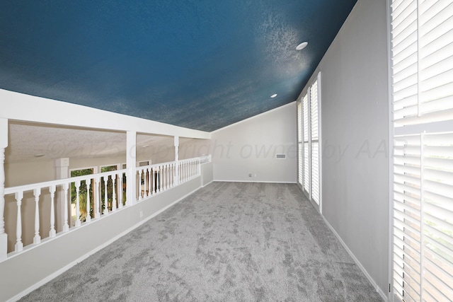 3801 Deann Dr, Amarillo, TX 79121 - additional living space featuring carpet flooring and vaulted ceiling