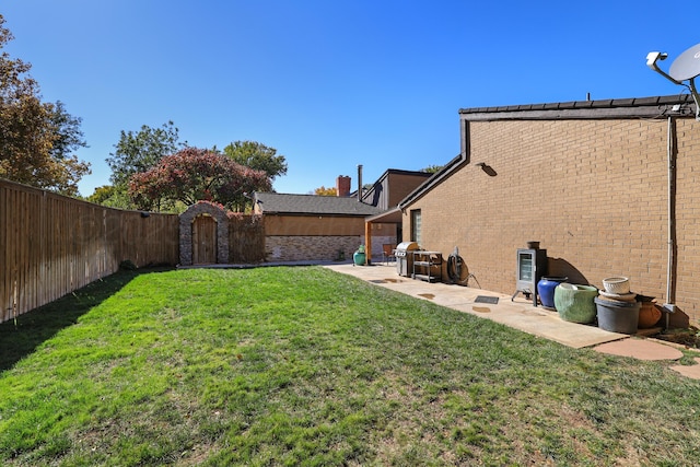3801 Deann Dr, Amarillo, TX 79121 - fenced backyard with a patio and a gate