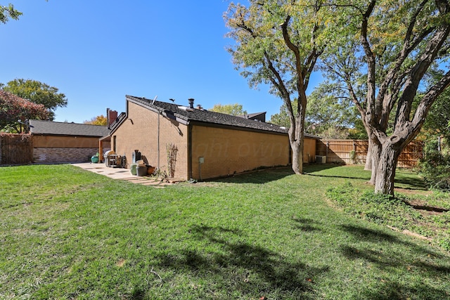 3801 Deann Dr, Amarillo, TX 79121 - back of property featuring brick siding and a patio