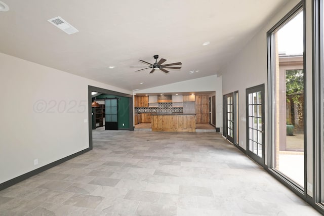 3801 Deann Dr, Amarillo, TX 79121 - unfurnished living room with lofted ceiling, a ceiling fan, healthy amount of natural light, and recessed lighting