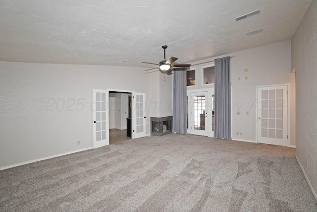 3801 Deann Dr, Amarillo, TX 79121 - unfurnished living room with french doors, carpet floors, and a ceiling fan