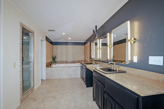 3801 Deann Dr, Amarillo, TX 79121 - full bathroom featuring vanity, a bath, a shower stall, crown molding, and recessed lighting